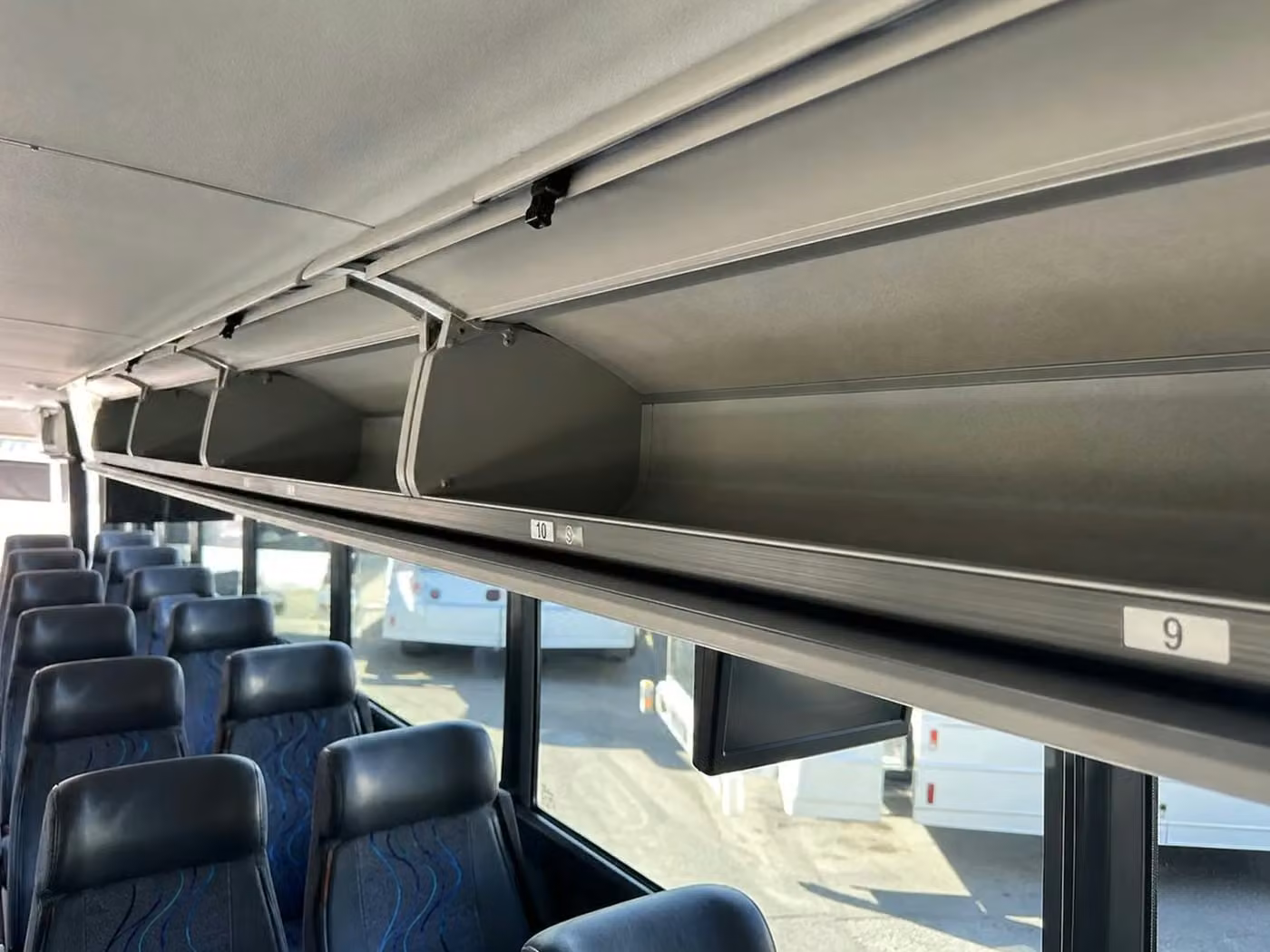 brooklyn center 56 passenger charter bus overhead storage